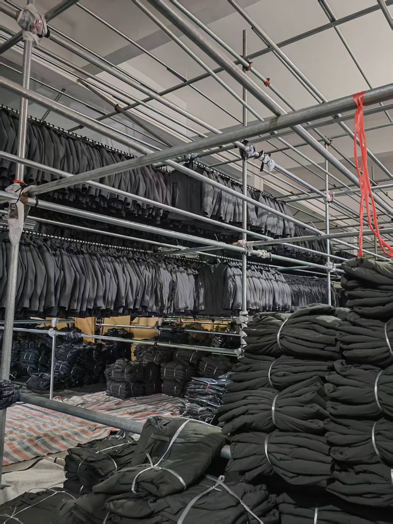 Finished garments hanging in a workshop